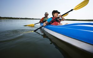 Two people in a canoe on the water.